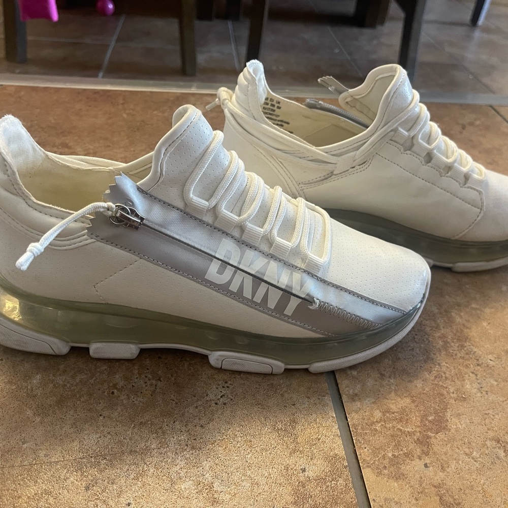 DKNY Women's White Slip-On Sneakers with Silver Logo Accent